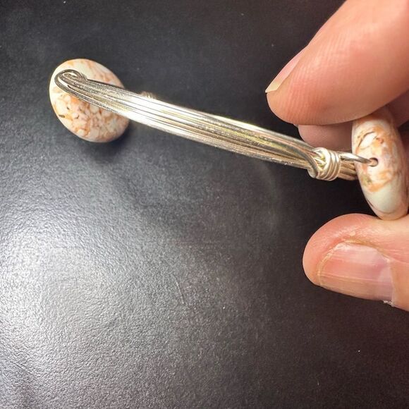 Silver wired metal bracelet with two oval brown swirled stones - Picture 8 of 8